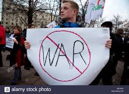 America at Riske for War photo of a man in protest against engaging in military action.