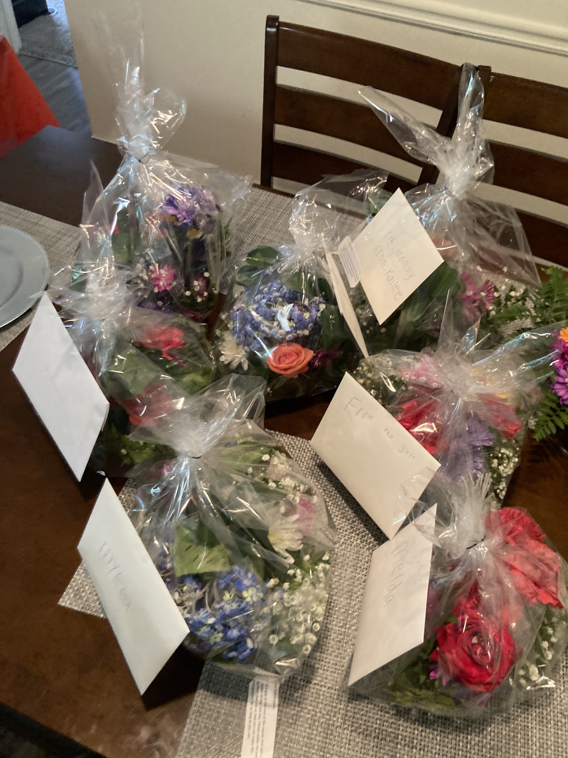 Final packaging of floral arrangements for Mother's Day